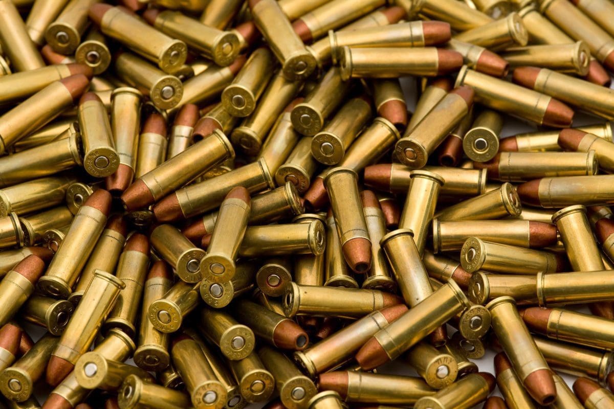 A pile of bullet casings sitting on top of each other.