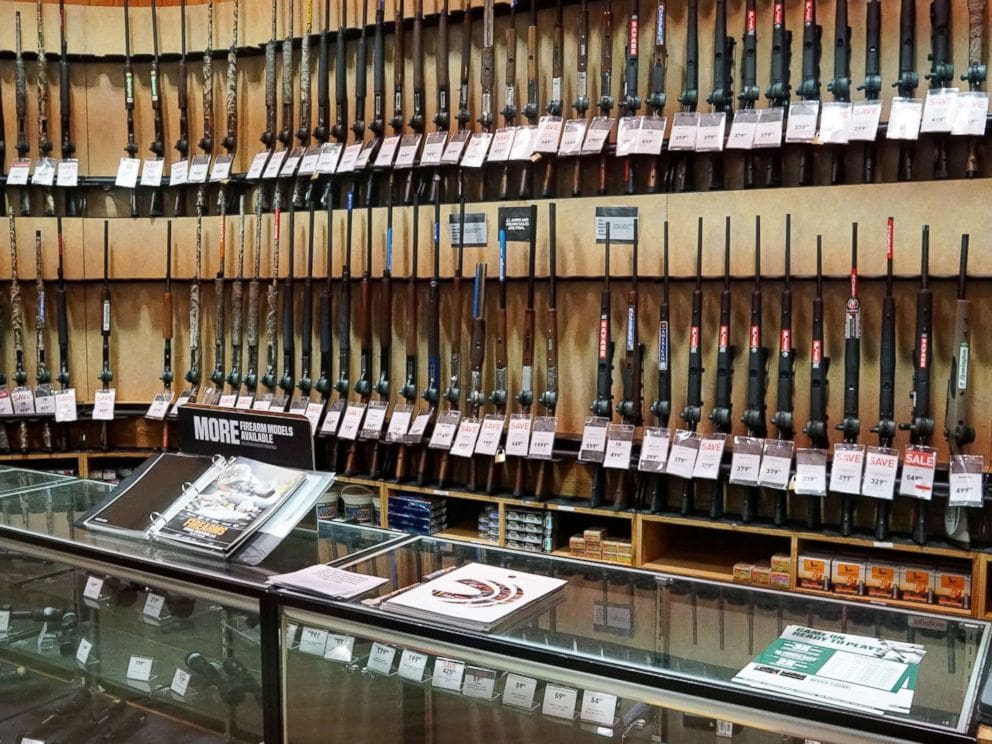 A store with many different types of guns on display.