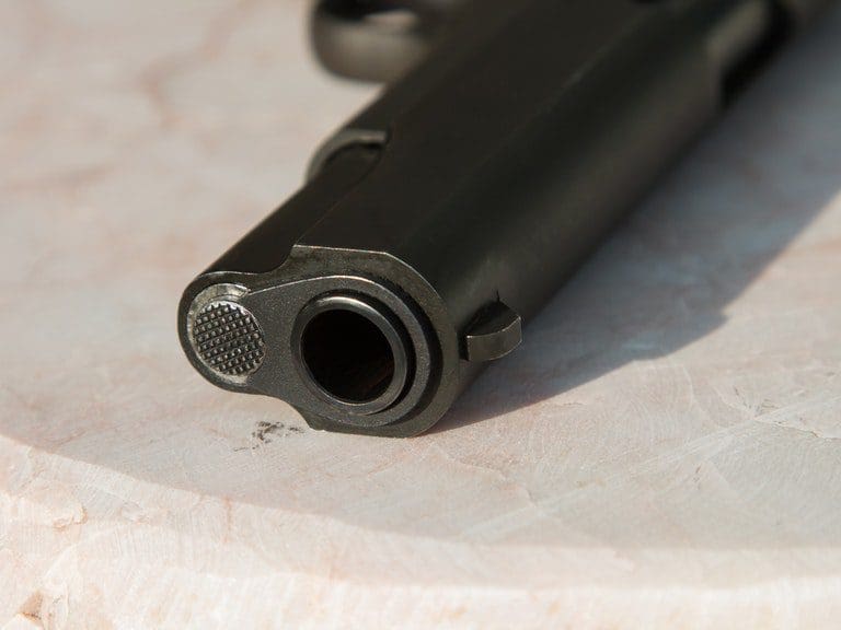 A close up of the barrel on a gun
